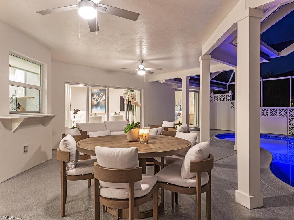 4856 Crayton Road Naples, FL 34103 - Photo 4 of 24 a dining room with furniture and window