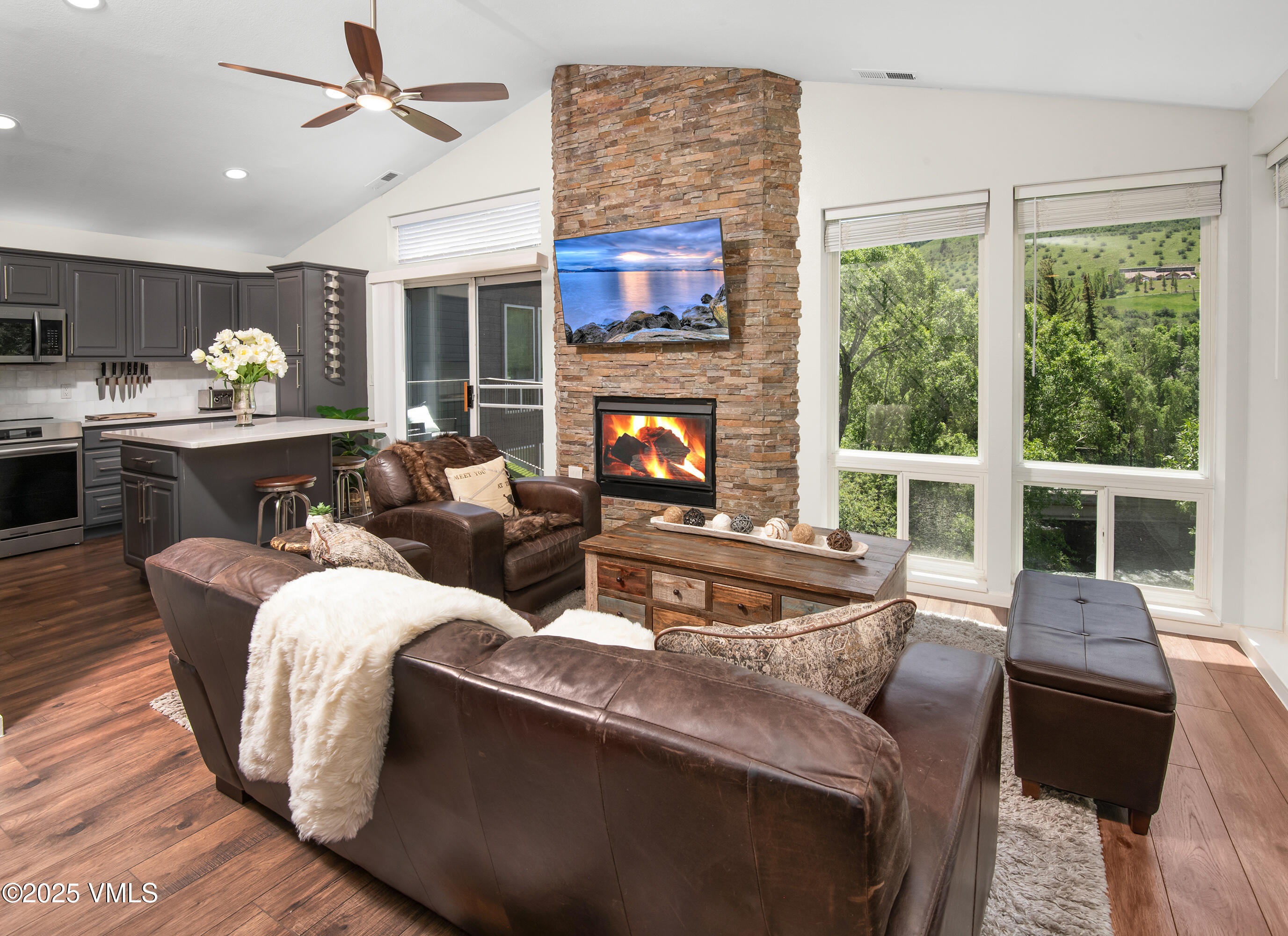 a living room with furniture fireplace and flat screen tv