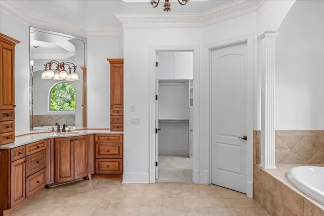 a view of a kitchen with wooden cabinets