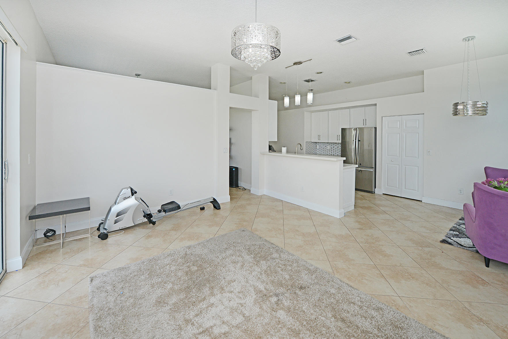 9513 Lake Serena Drive Boca Raton, FL 33496 - Photo 11 of 26 a room with a chandelier furniture and kitchen view
