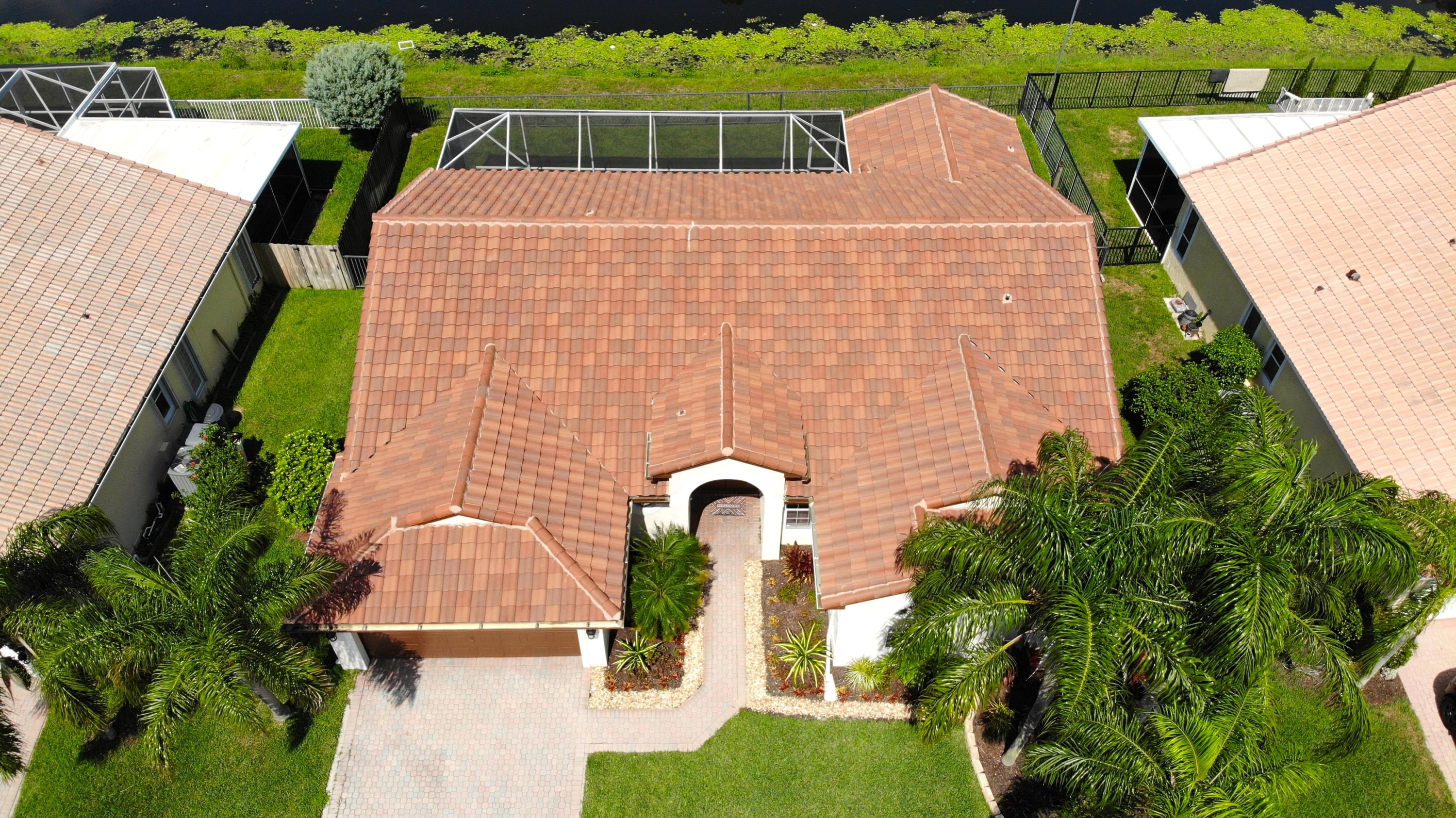 9513 Lake Serena Drive Boca Raton, FL 33496 - Photo 24 of 26 a aerial view of a house with garden space and plants