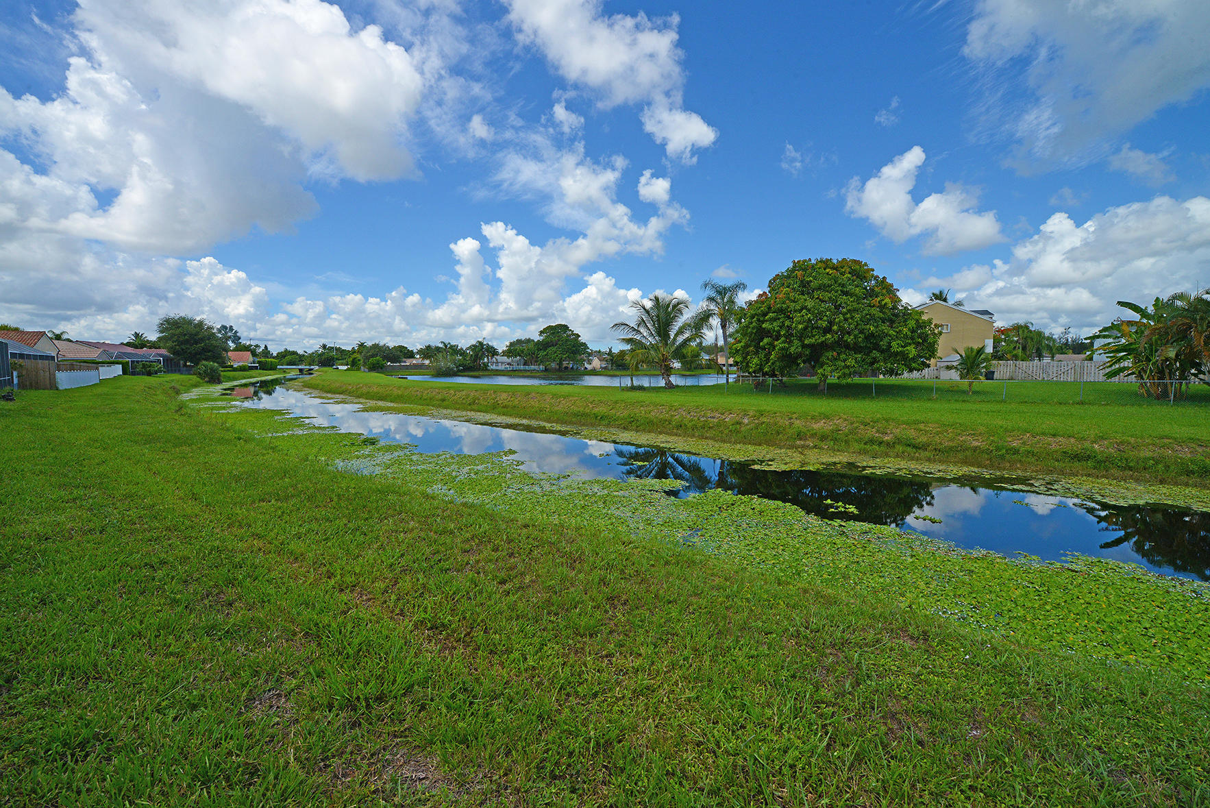9513 Lake Serena Drive Boca Raton, FL 33496 - Photo 25 of 26 a view of a golf course with a lake