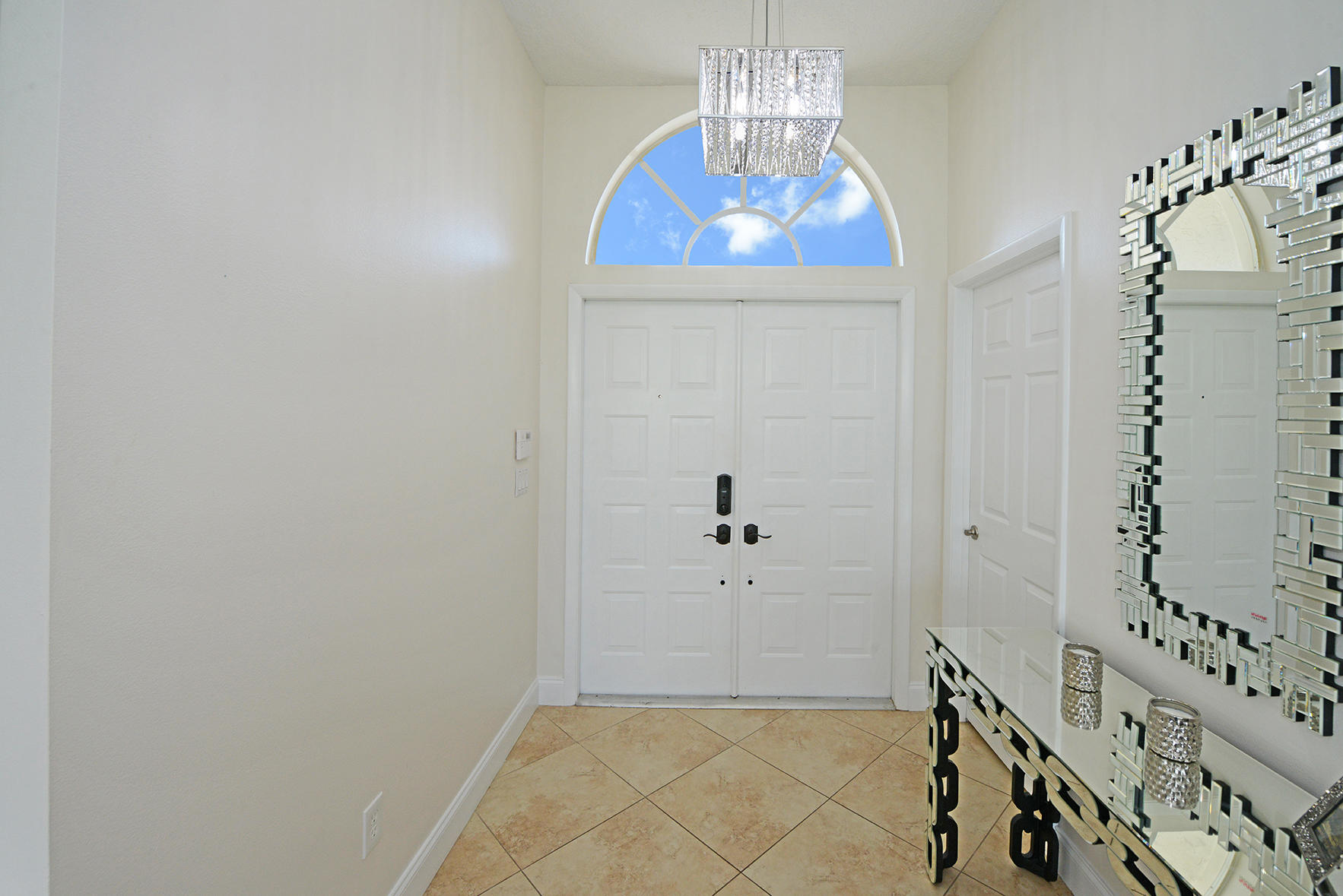 9513 Lake Serena Drive Boca Raton, FL 33496 - Photo 5 of 26 a view of an entryway with wooden floor