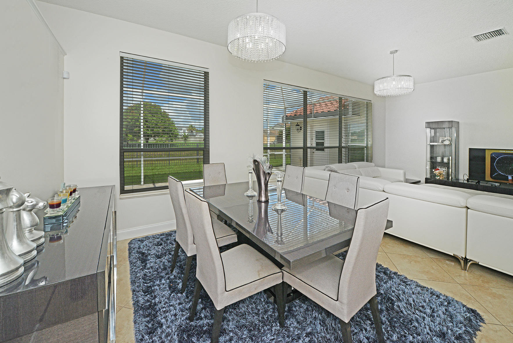 9513 Lake Serena Drive Boca Raton, FL 33496 - Photo 8 of 26 a view of a dining room with furniture window and outside view