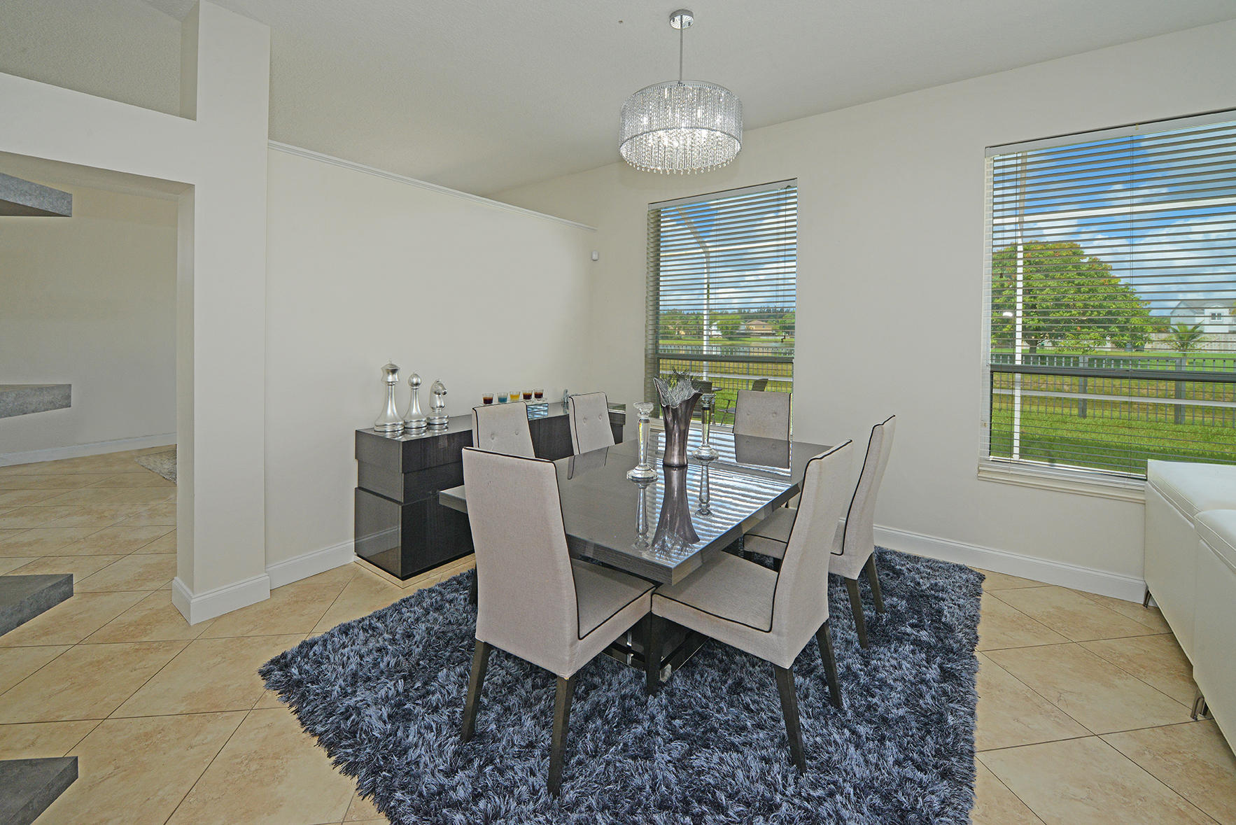 9513 Lake Serena Drive Boca Raton, FL 33496 - Photo 9 of 26 a dining room with furniture and window