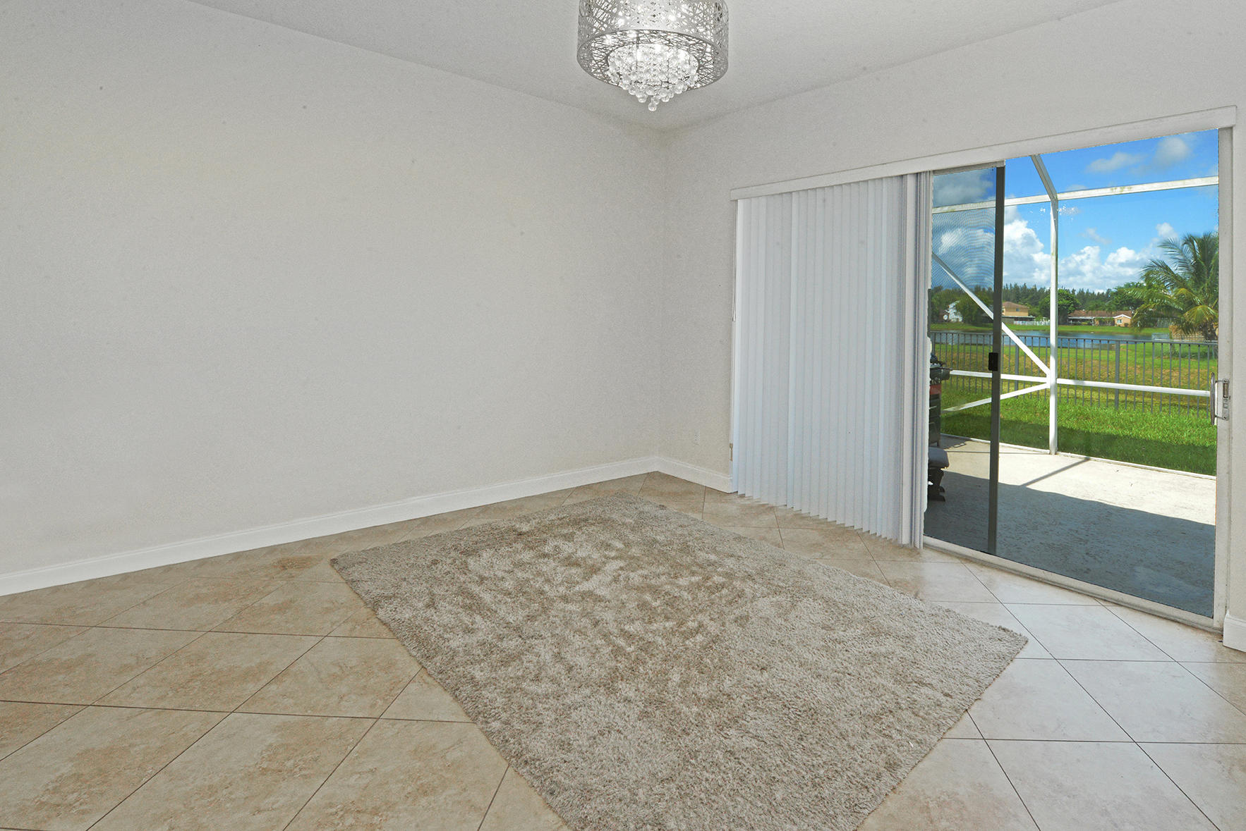 9513 Lake Serena Drive Boca Raton, FL 33496 - Photo 10 of 26 a view of empty room with floor to ceiling window