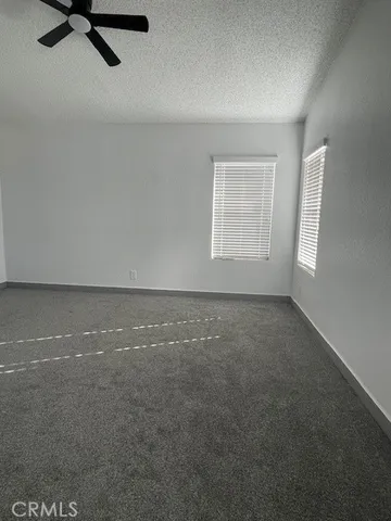 an empty room with a empty space and windows