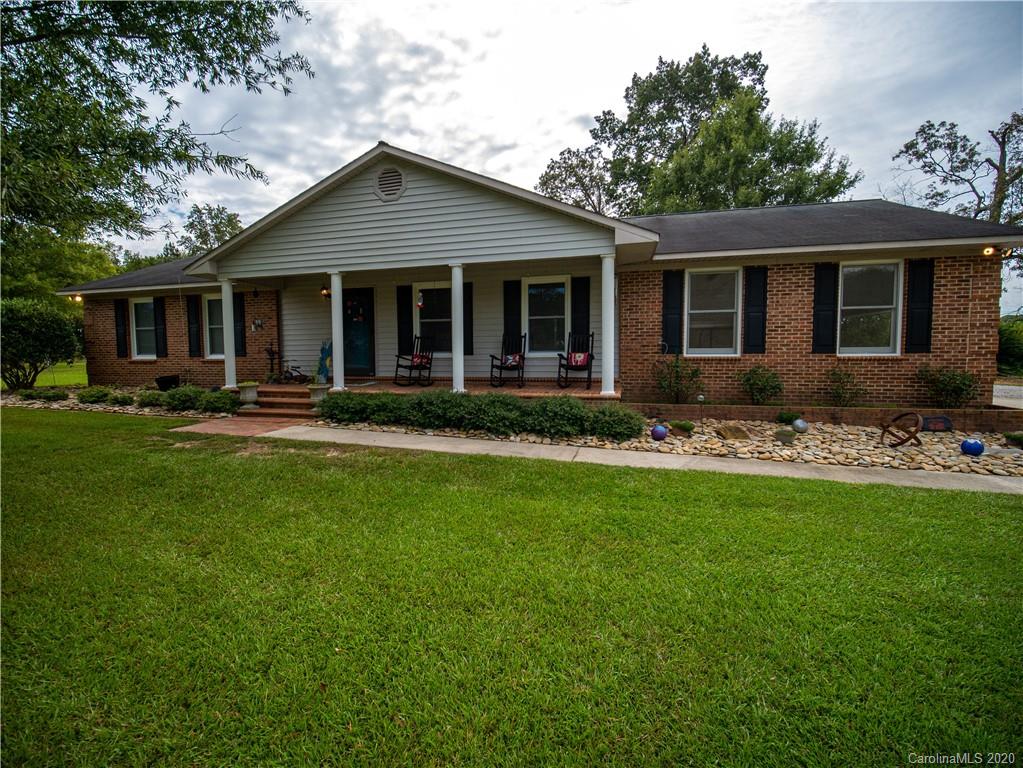 5610 Camp Creek Road Lancaster, SC 29720 - Photo 2 of 21 a front view of a house with garden and porch