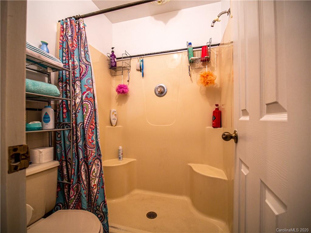 5610 Camp Creek Road Lancaster, SC 29720 - Photo 17 of 21 a bathroom with a shower a toilet and a sink