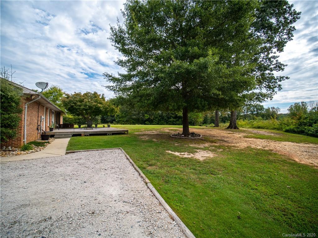 5610 Camp Creek Road Lancaster, SC 29720 - Photo 7 of 21 a view of a park with swings and a trees