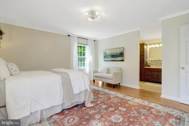 a spacious bedroom with a bed and a couch