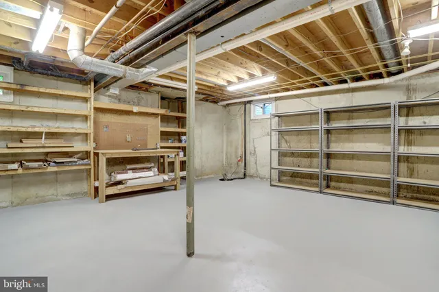 a view of a room with wooden shelves