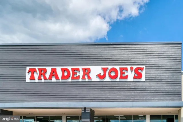 a street sign that is on a wooden wall