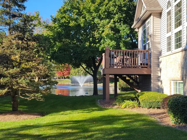 a view of a house with a small yard