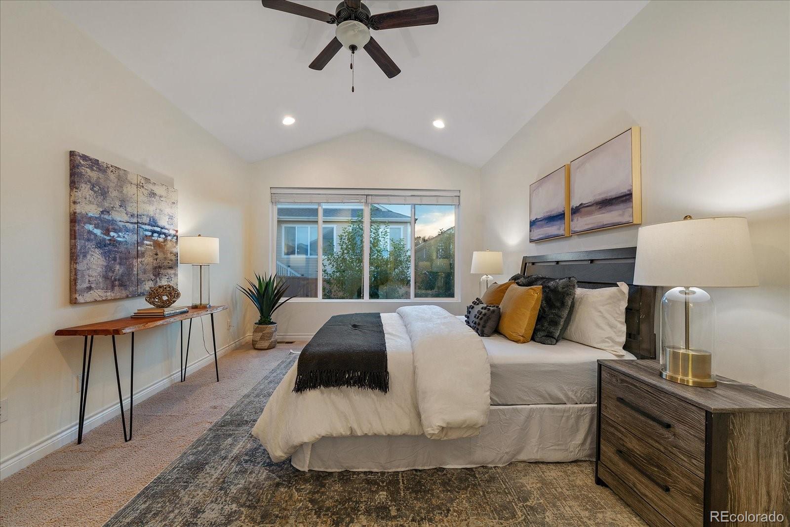 11526 Colony Loop Parker, CO 80138 - Photo 19 of 29 a bed room with furniture and a window