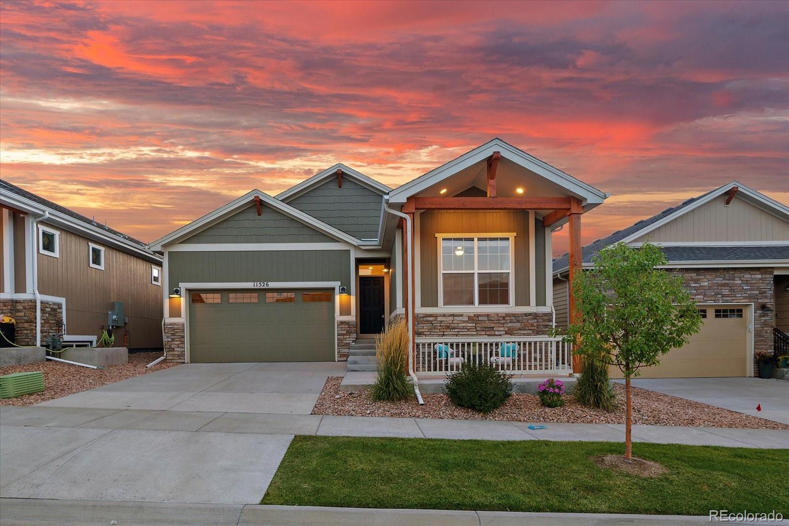 11526 Colony Loop Parker, CO 80138 - Photo 2 of 29 front view of house with a yard