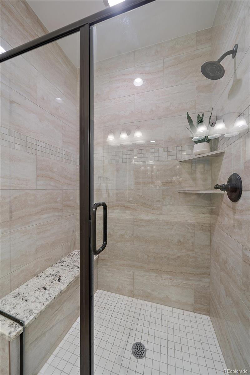 11526 Colony Loop Parker, CO 80138 - Photo 22 of 29 a bathroom with a shower