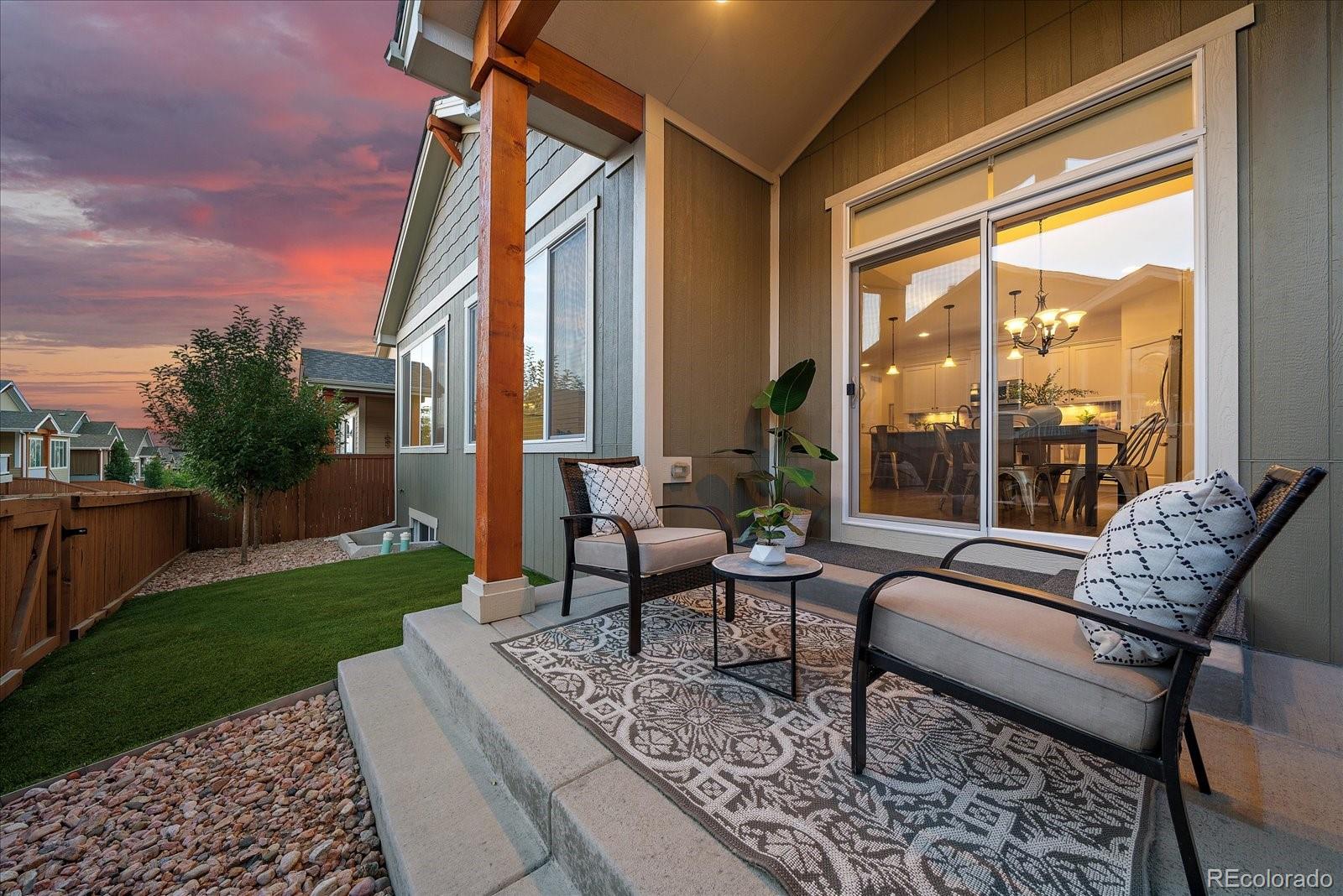 11526 Colony Loop Parker, CO 80138 - Photo 27 of 29 a balcony with furniture and a garden