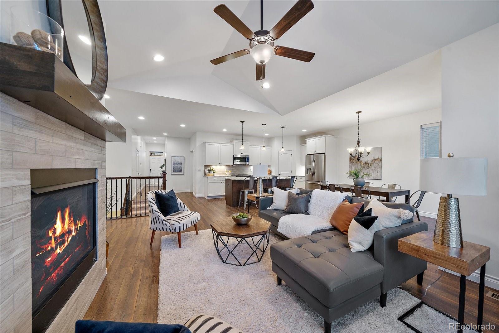 11526 Colony Loop Parker, CO 80138 - Photo 9 of 29 a living room with furniture and a fireplace