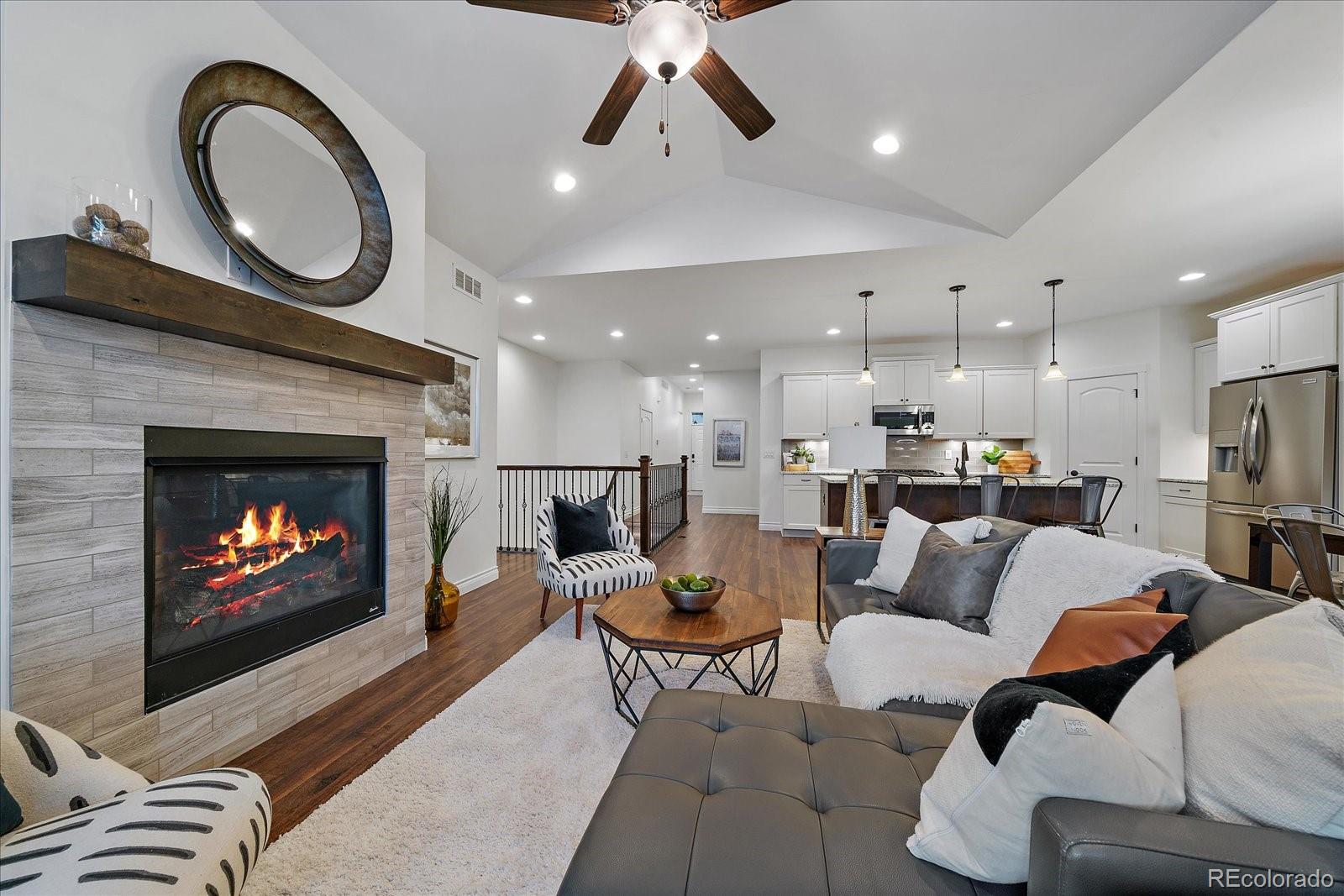 11526 Colony Loop Parker, CO 80138 - Photo 10 of 29 a living room with furniture and a fireplace