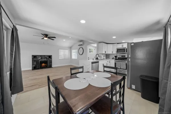 a kitchen with a table and chairs in it