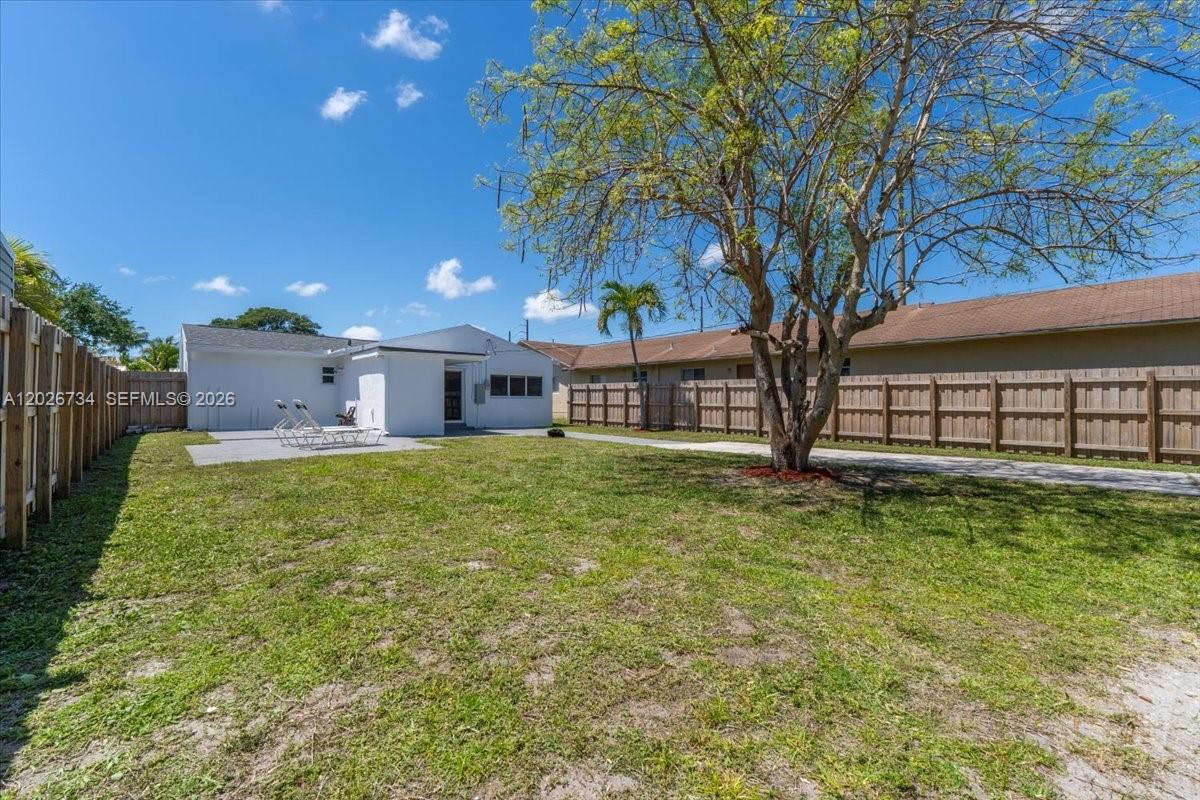 266 Southwest 6th Street Dania Beach, FL 33004 - Photo 31 of 37 a front view of a house with garden