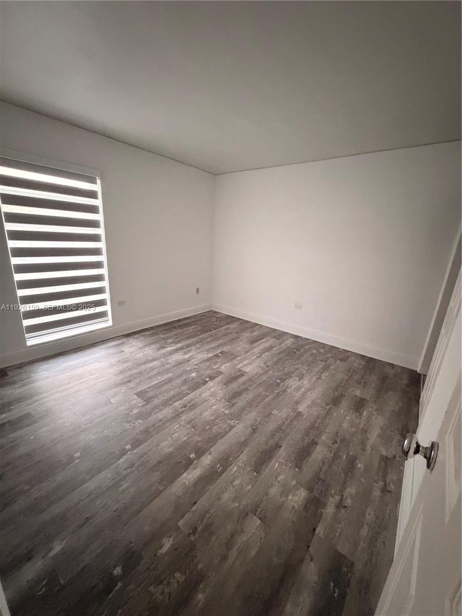 7250 Southwest 94th Place, Unit B8 Miami, FL 33173 - Photo 11 of 18 wooden floor in a room