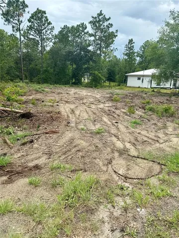 a view of outdoor space with deck and yard