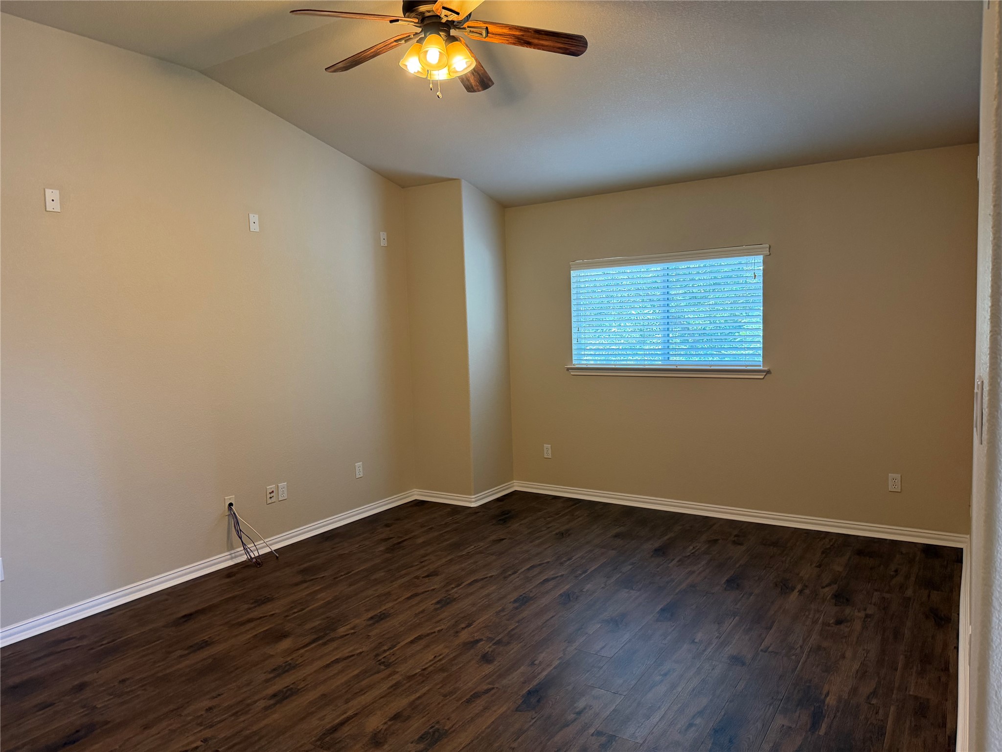3021 Grand Mission Way Pflugerville, TX 78660 - Photo 22 of 31 Rich hardwood-style flooring and a ceiling fan provide comfort in this versatile space.