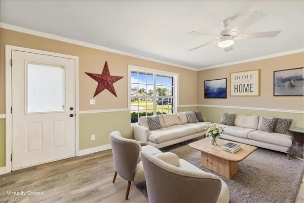 a living room with furniture and a window