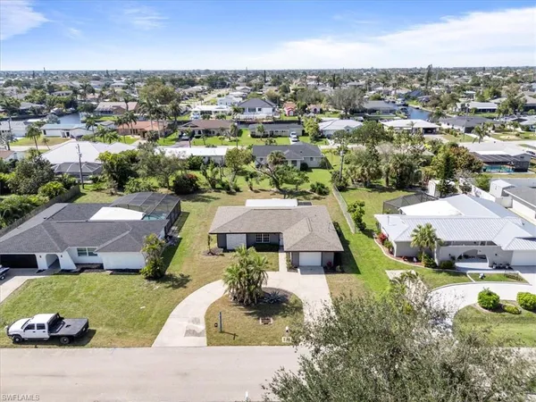 an aerial view of a house with a garden