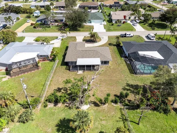 a view of a house with a swimming pool and outdoor space