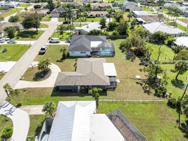 an aerial view of a house with a garden
