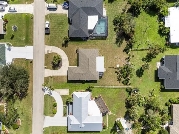 an aerial view of a house with a swimming pool