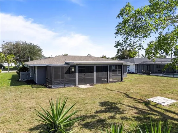 a house with swimming pool in front of it