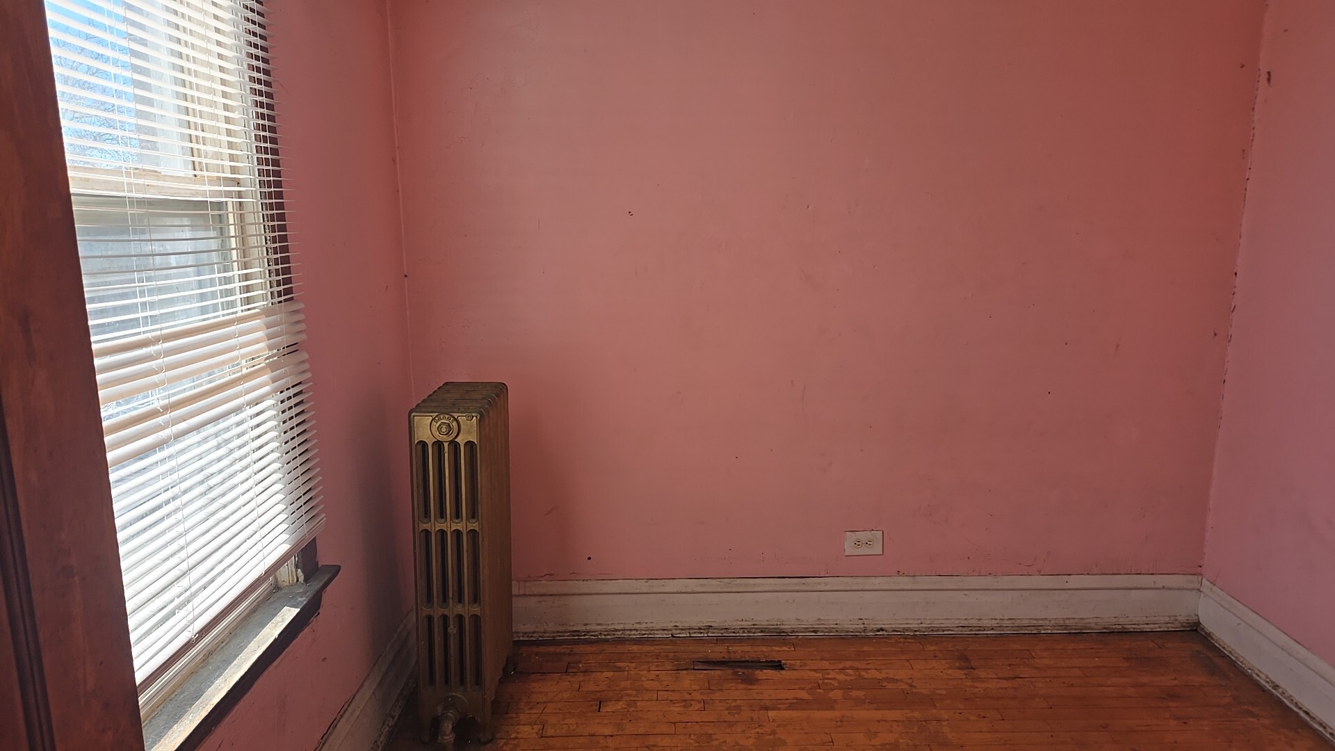 134 West 107th Street Chicago, IL 60628 - Photo 20 of 24 a view of a small space with wooden floor and a window