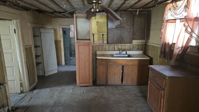 a bathroom with a sink and mirror