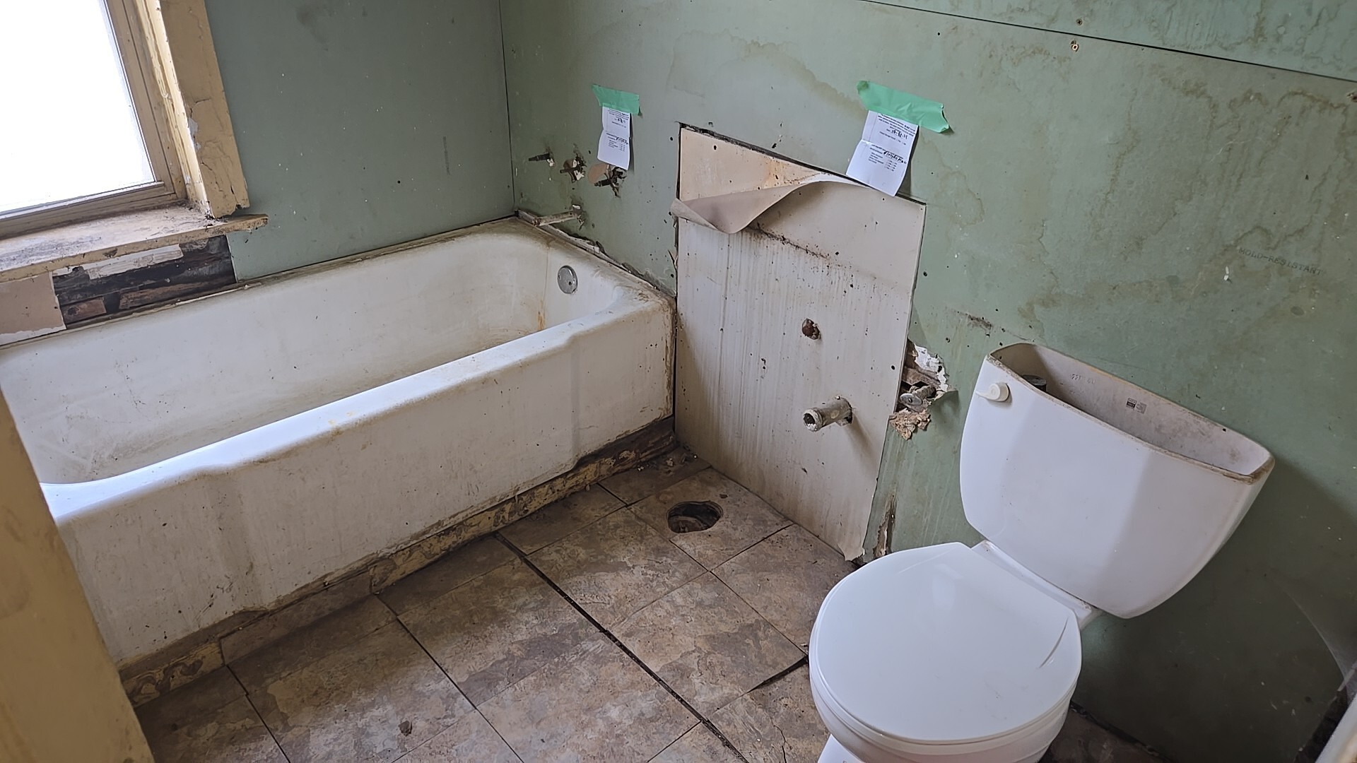 134 West 107th Street Chicago, IL 60628 - Photo 9 of 24 a bathroom with a sink and a toilet
