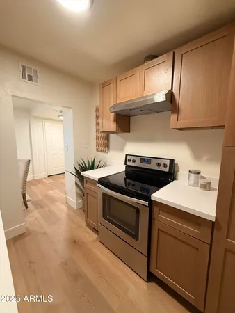 a kitchen with a stove and a sink