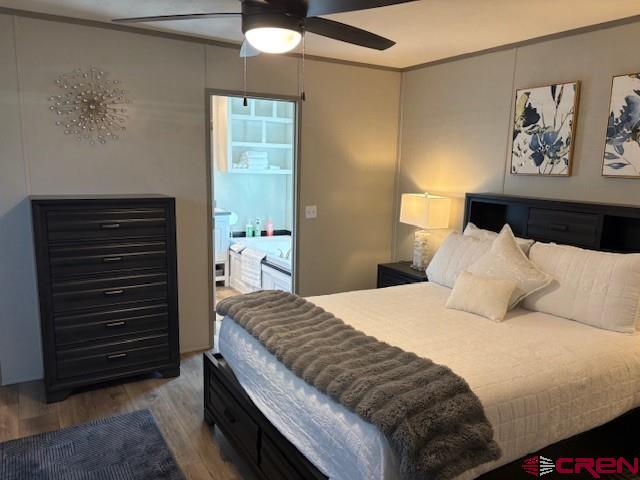 260 Southwest 13th Circle Cedaredge, CO 81413 - Photo 12 of 15 a bedroom with a bed and a painting on the wall