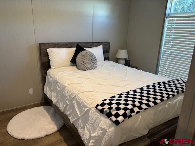 260 Southwest 13th Circle Cedaredge, CO 81413 - Photo 13 of 15 a bedroom with a bed and a couch