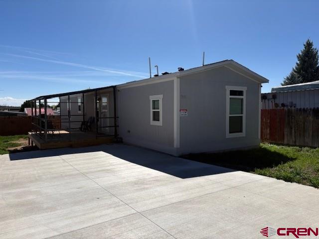 260 Southwest 13th Circle Cedaredge, CO 81413 - Photo 2 of 15 a black car parked in front of house
