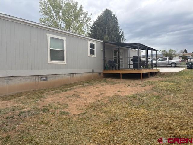 260 Southwest 13th Circle Cedaredge, CO 81413 - Photo 3 of 15 a front view of a house with a yard