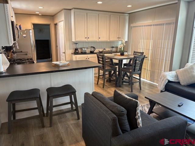 260 Southwest 13th Circle Cedaredge, CO 81413 - Photo 8 of 15 a living room with furniture and wooden floor