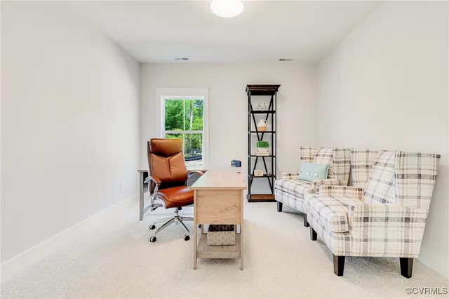 a work room with furniture and windows