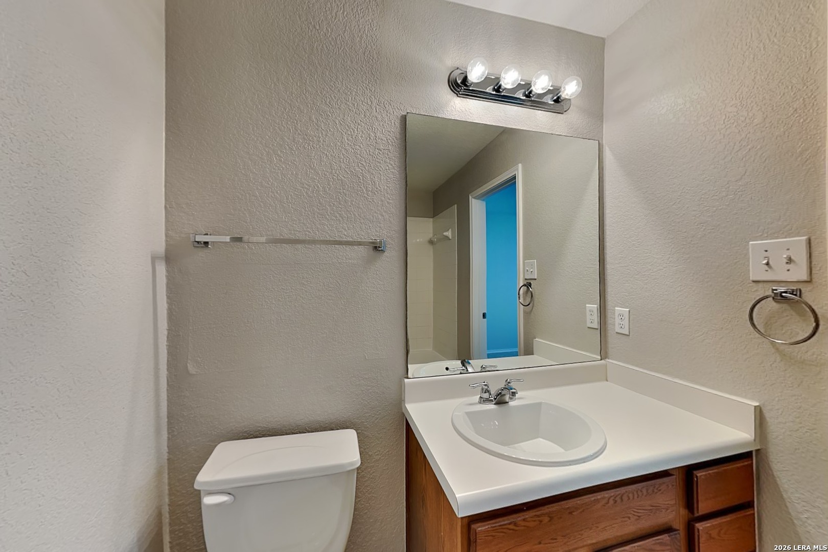 6510 Poseidon Way Converse, TX 78109 - Photo 8 of 16 a bathroom with a sink and a mirror