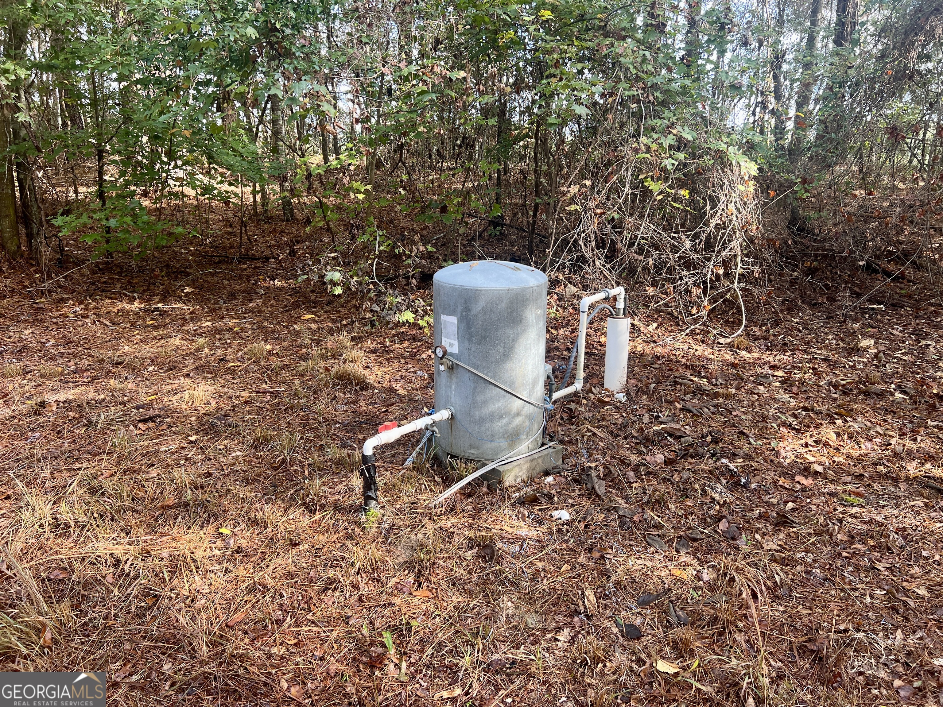 136 Pope Road Pineview, GA 31071 - Photo 28 of 58 a backyard of a house with table and chairs