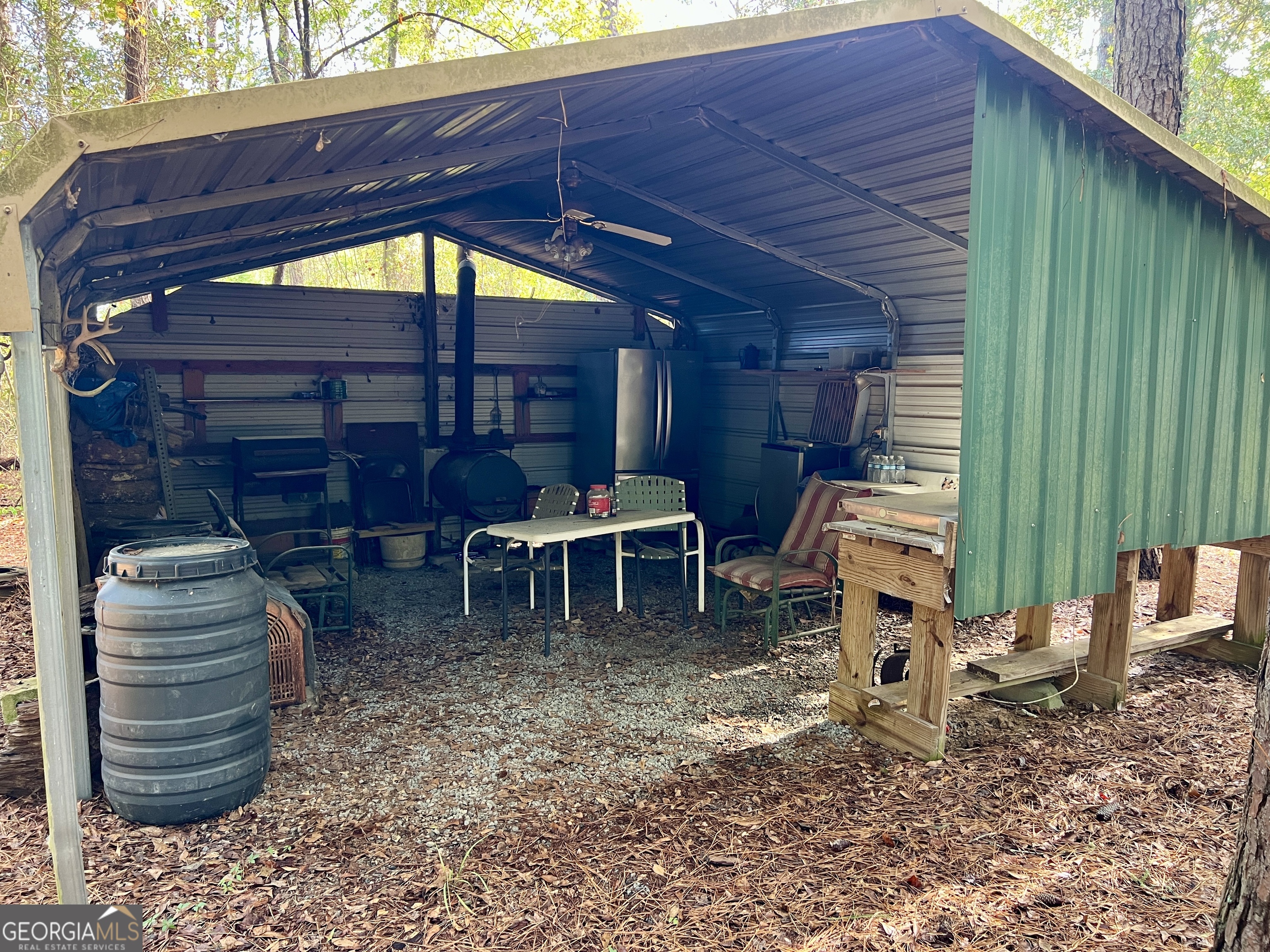 136 Pope Road Pineview, GA 31071 - Photo 30 of 58 a view of a chairs and table in backyard