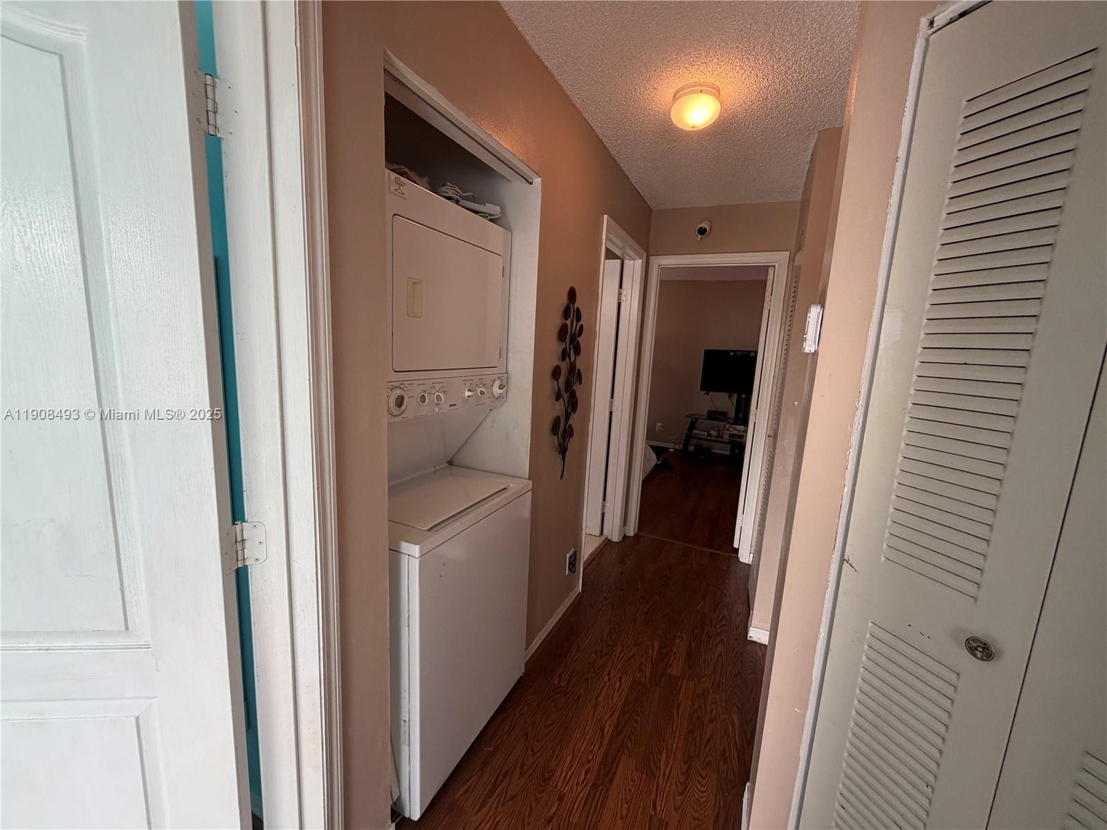810 Northeast 212th Terrace, Unit 2 Miami, FL 33179 - Photo 33 of 44 a bathroom with a shower and a tub