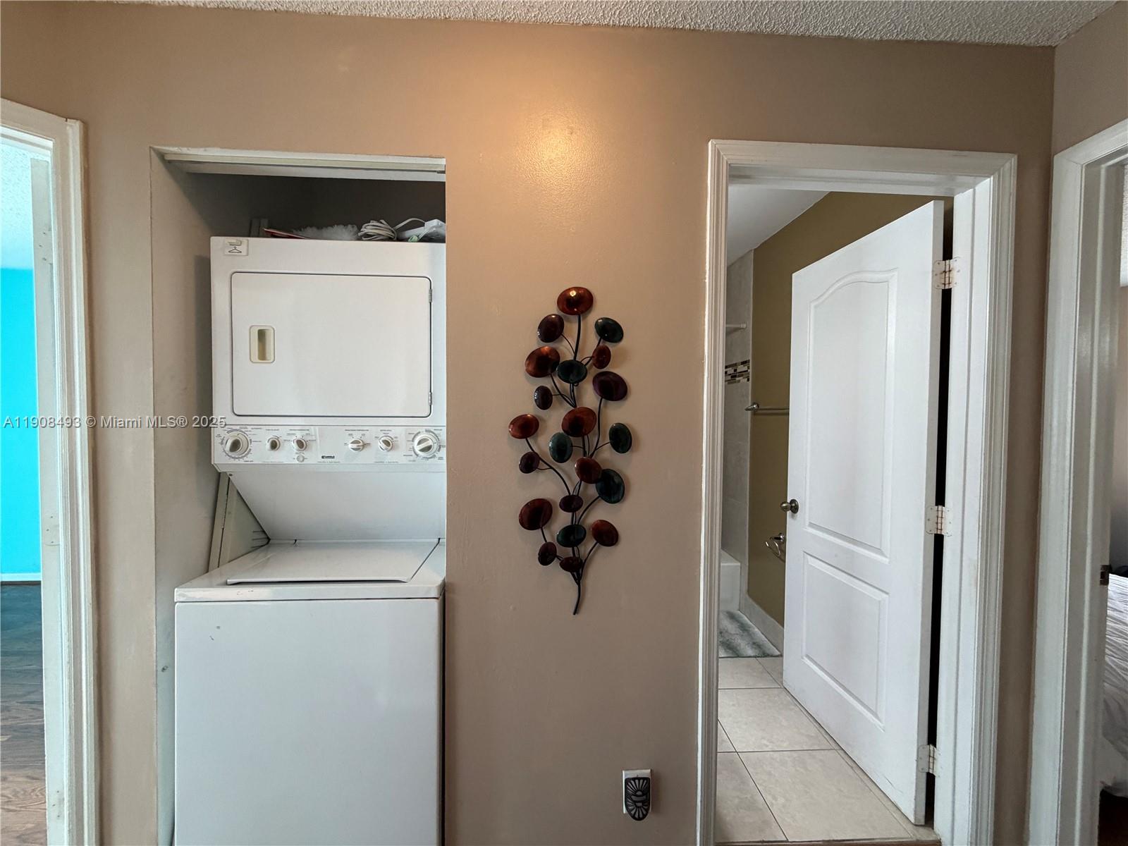 810 Northeast 212th Terrace, Unit 2 Miami, FL 33179 - Photo 36 of 44 a bathroom with a toilet and a sink